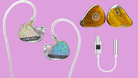 Three in-ear monitors (IEMs) on a pink background. 