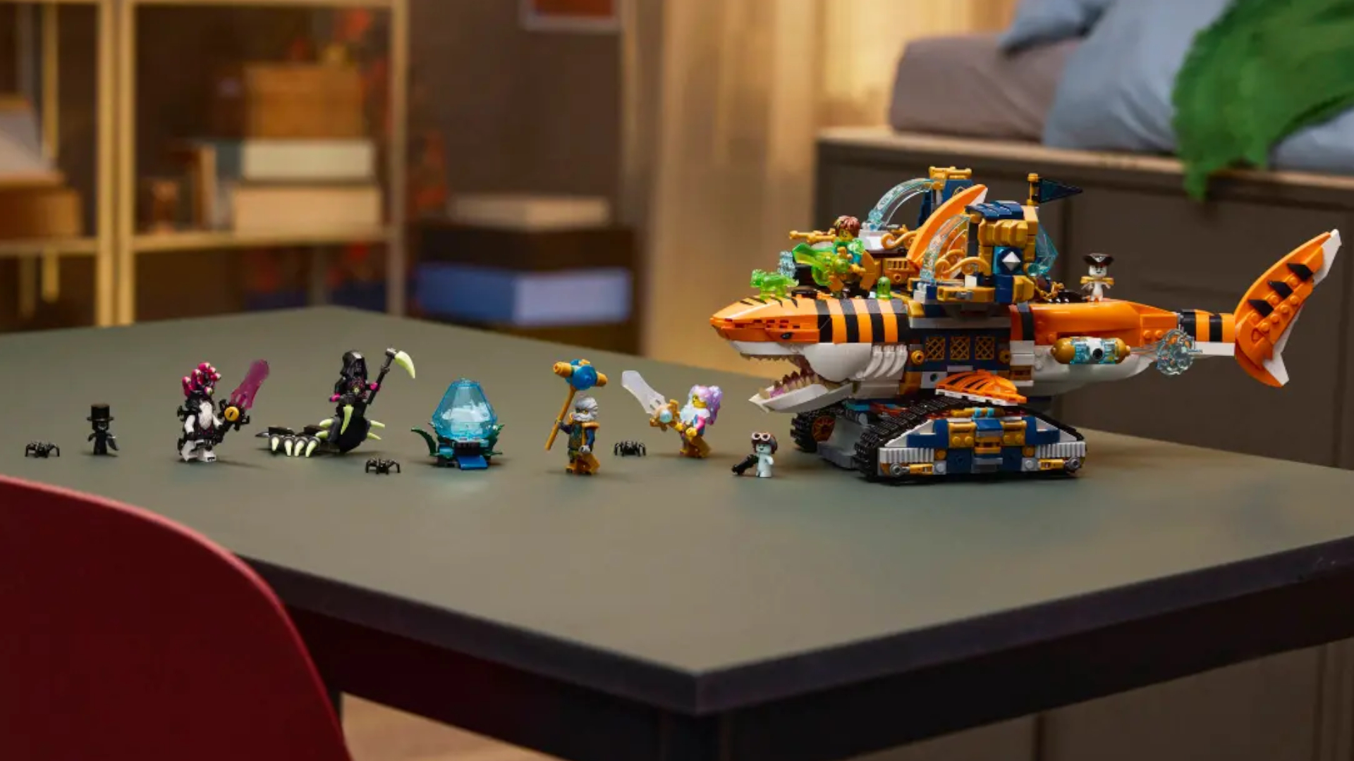 A Lego robot shark and minifigures laid out in a line on a table