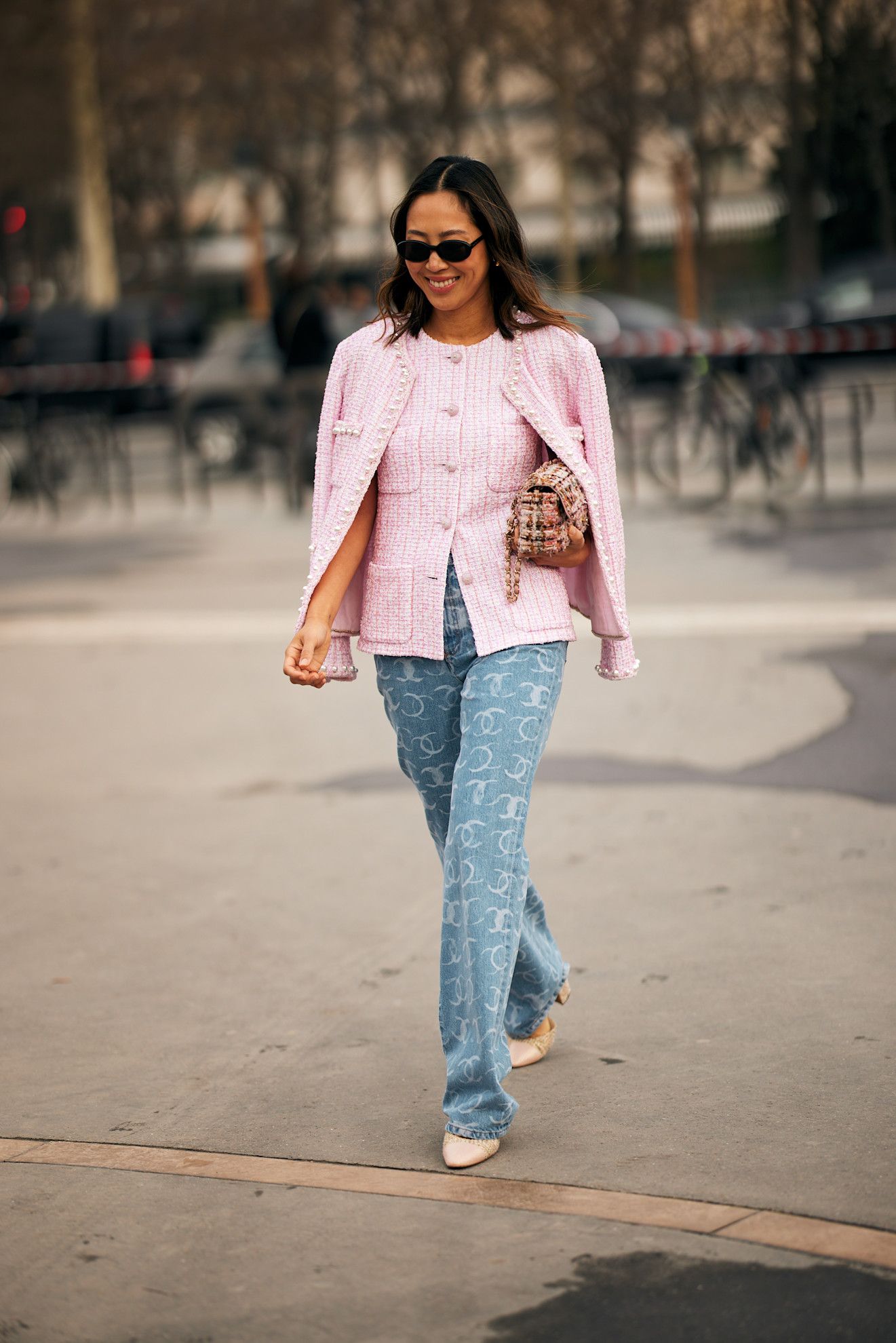 Woman wearing printed jeans controversial denim trend.