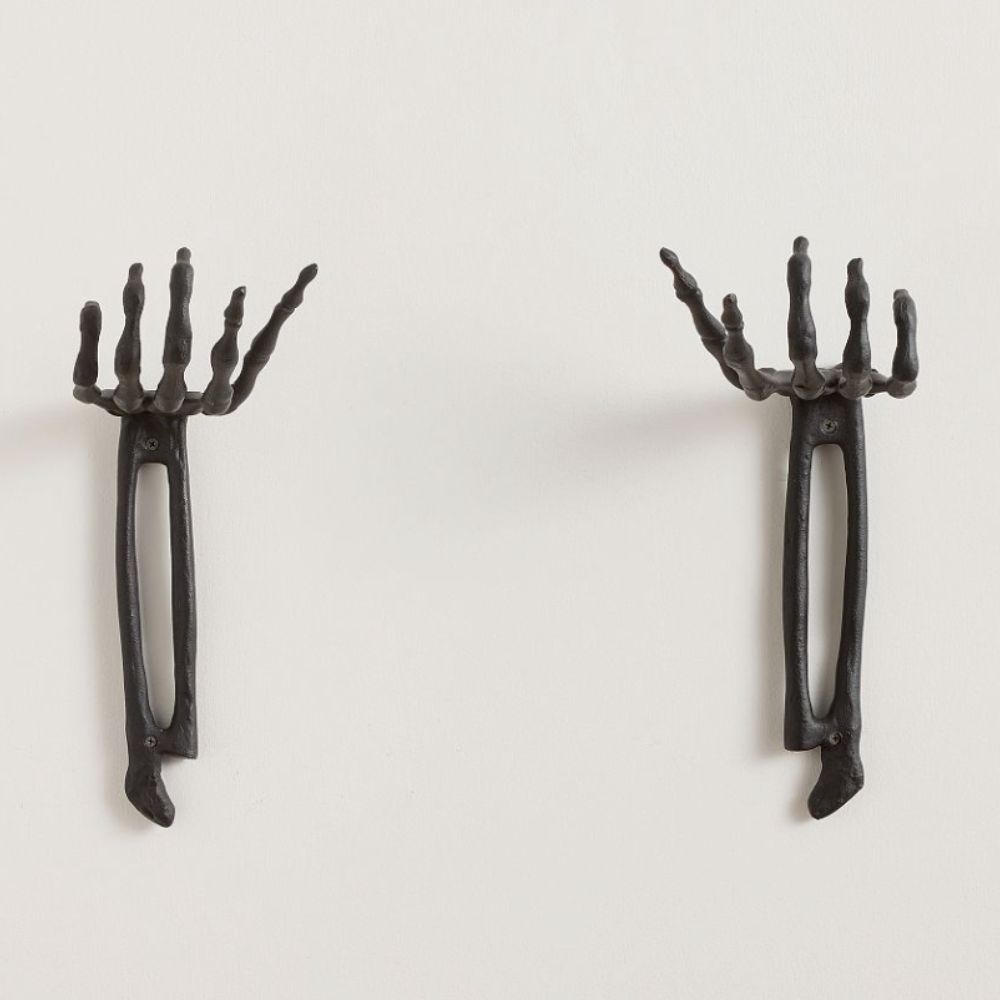 two black skeleton hand wall mounts