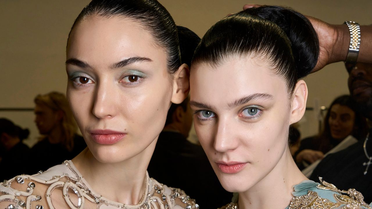 women with glowy skin backstage at a fashion show