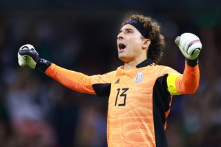 Guillermo Ochoa celebrates a Mexico goal against Honduras in a World Cup qualifier in October 2021.