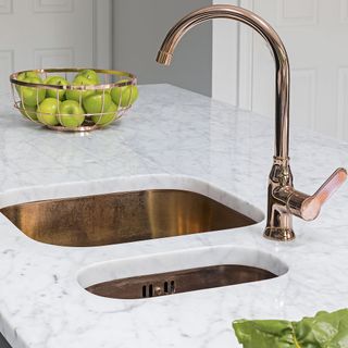 kitchen with copper tap and marble worktop
