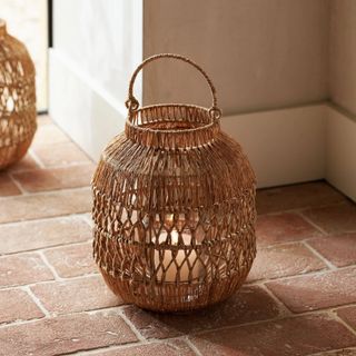 The White Company jute candle holder on the floor
