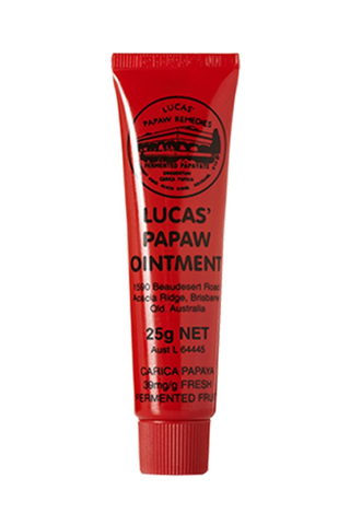 An unopened red tube of Lucas' Papaw Ointment with black text set against a white background.