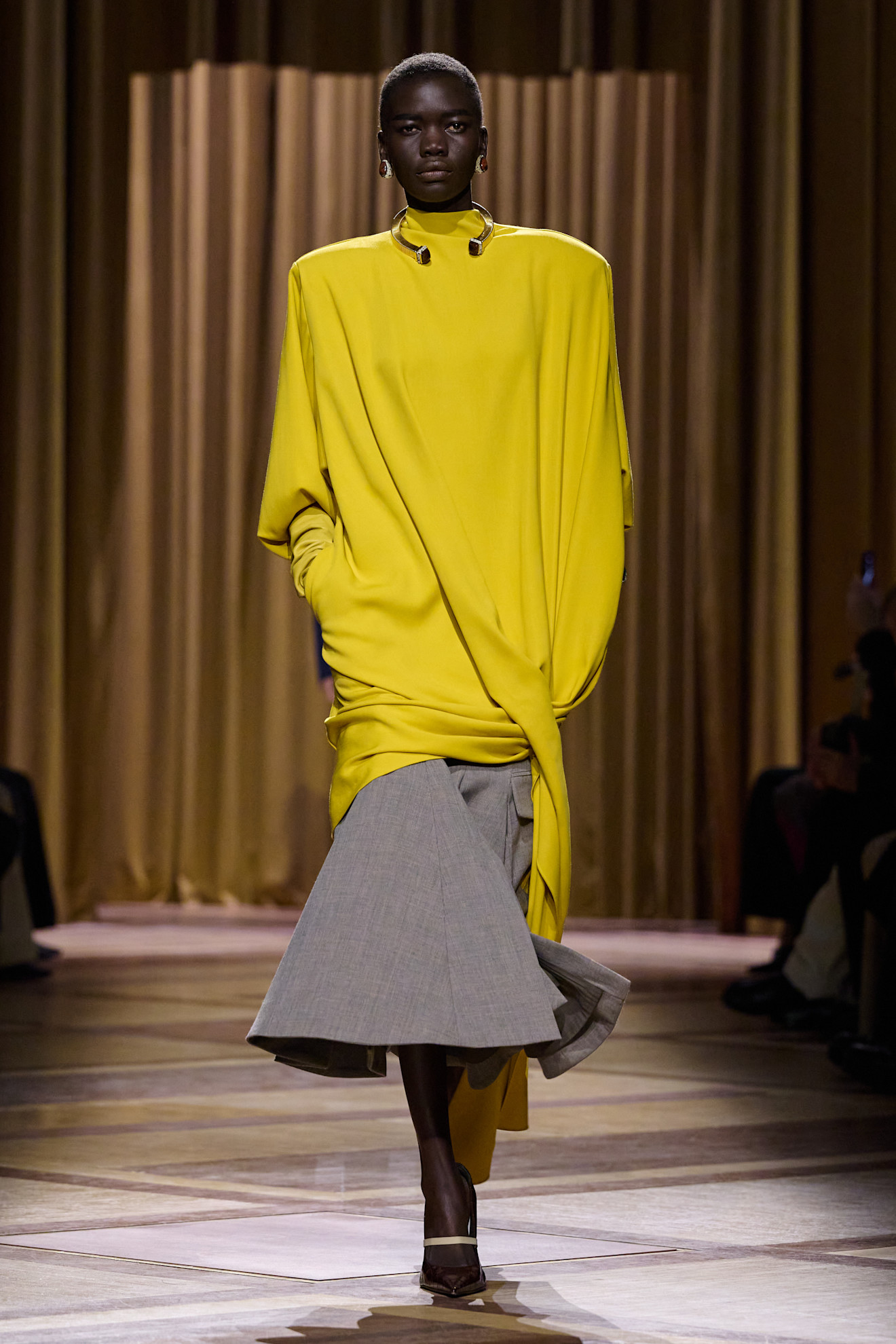 A model wore an acid yellow top on the Mugler Fall 2026 runway