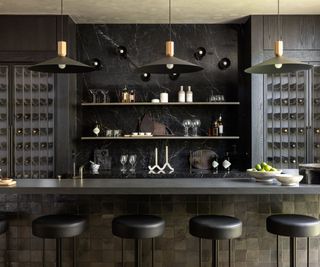 Monochromatic black home bar with a variety of stylish storage options