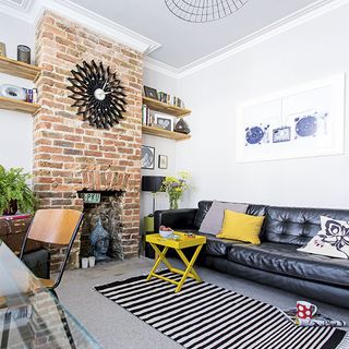 exposed brick with sofa and cushions
