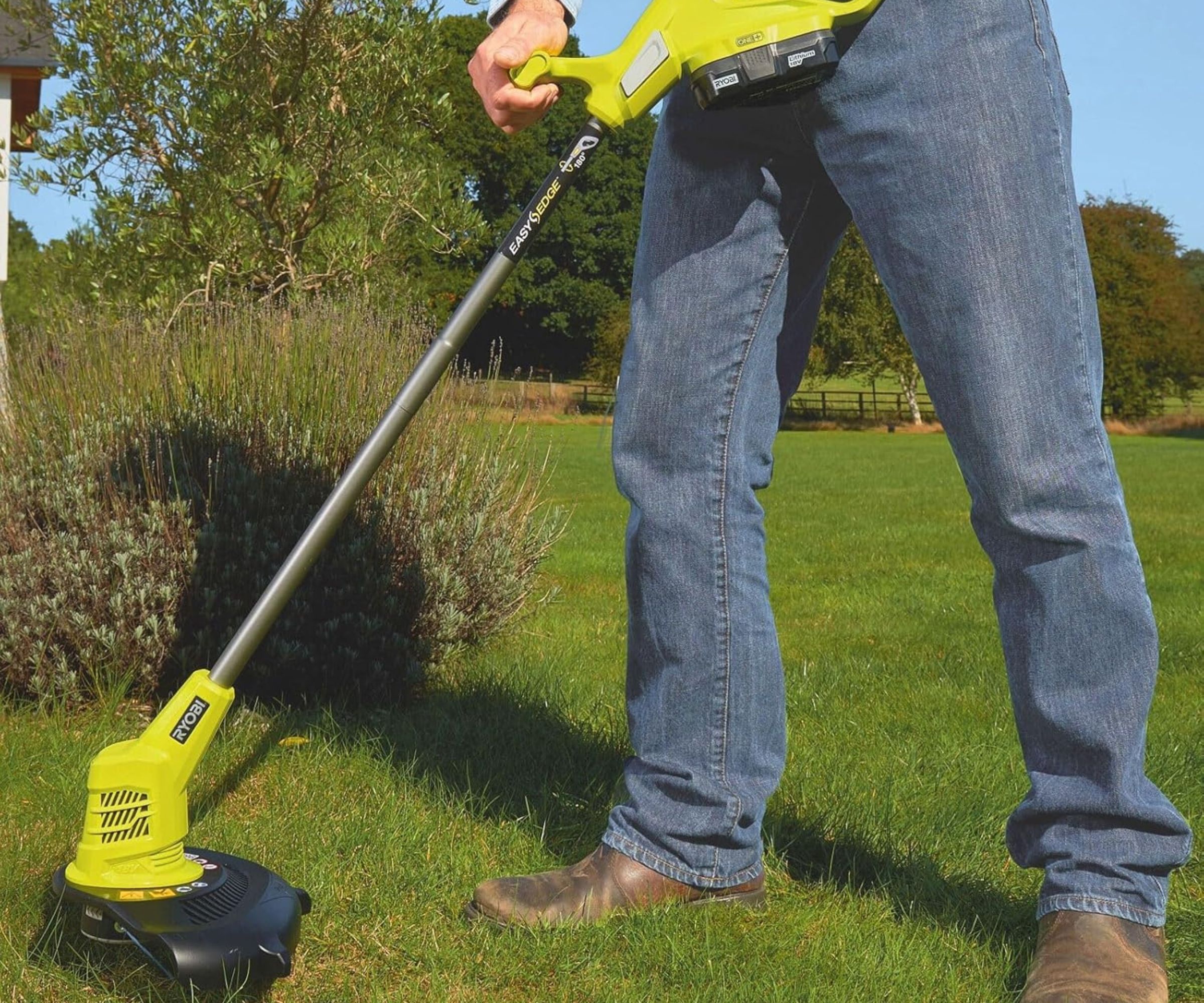 RYOBI 5133002822 18V ONE+ Cordless Grass Trimmer being held by man