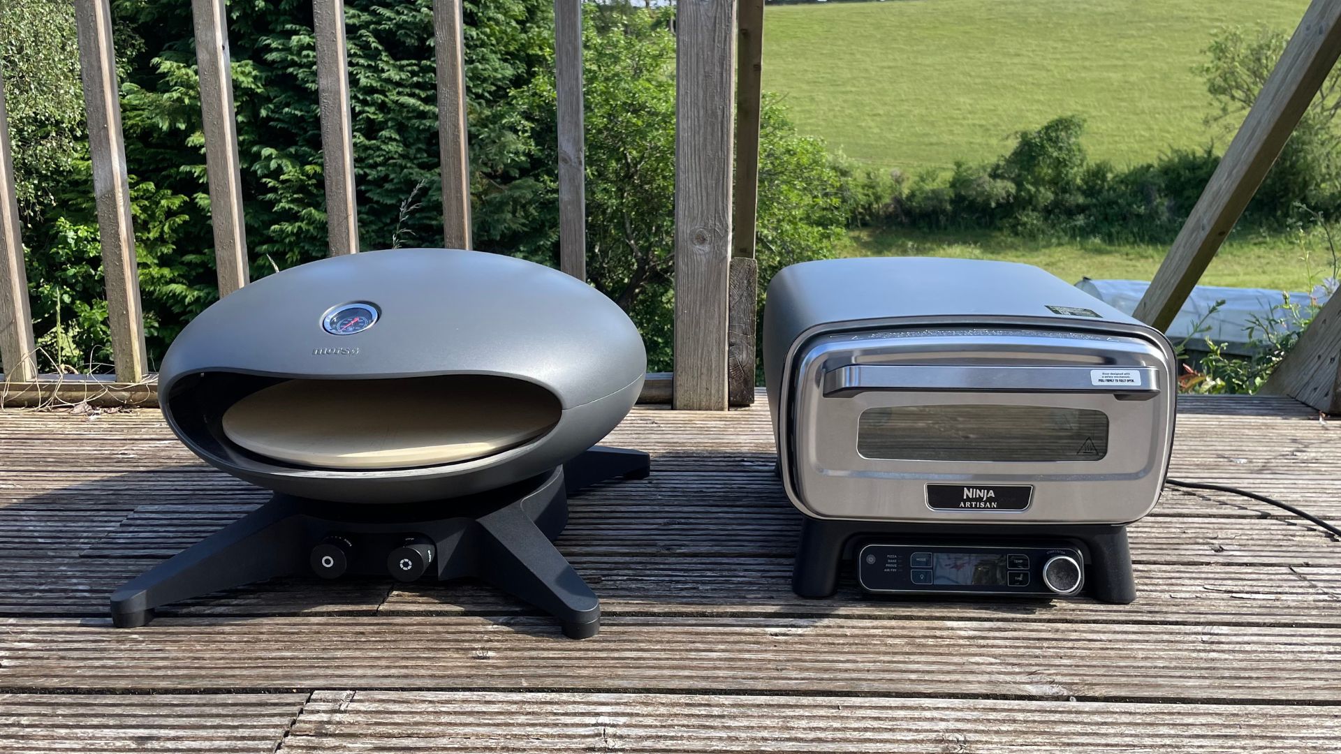 Ninja Artisan Electric Outdoor Pizza Oven and Air Fryer next to the Morso Forno Spin