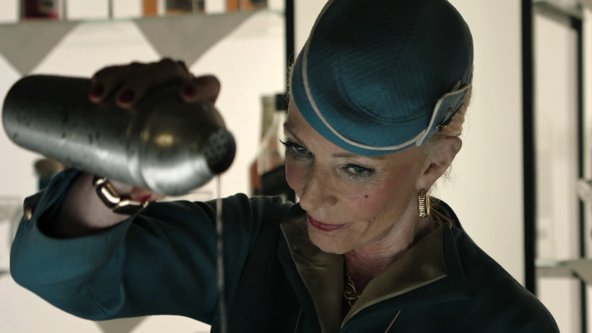 Allison Janney as bartender pouring from a shaker in The Dog Stars