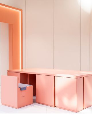 Pink room with a desk and chair