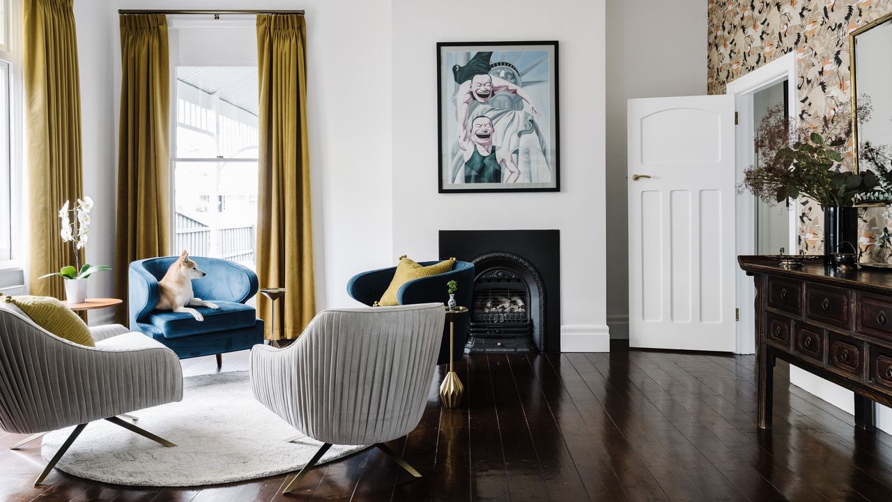 A round rug on a stained wooden floor