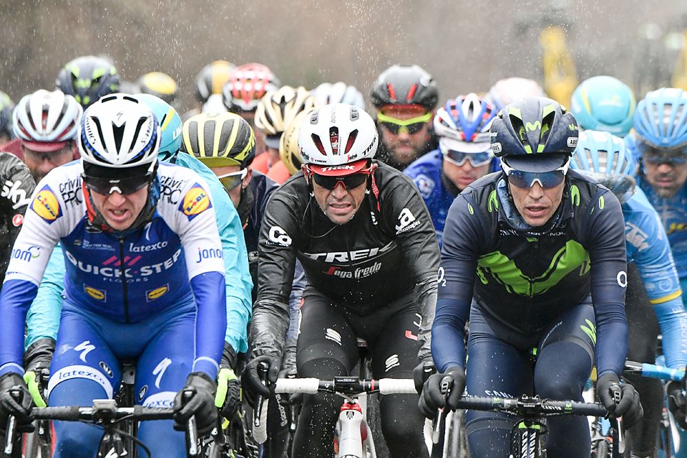 Ireland's Daniel Martin, Spain's Alberto Contador and Spain's Jose Herrada Lopez ride in the rain