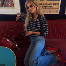 woman in striped polo top and jeans