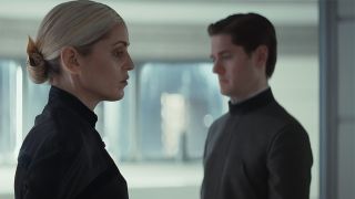 Dedra standing with Syril standing in the background in Andor season 2 episode 3