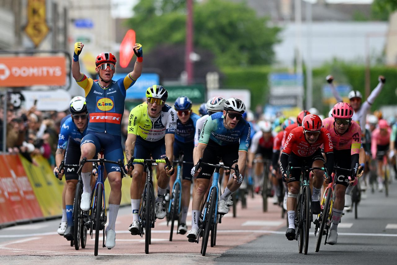 Mads Pedersen celebrates his win on stage one of the Criterium du Dauphine