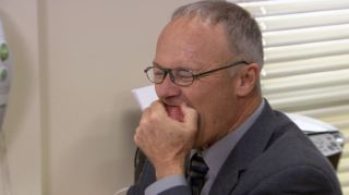 Creed eating a potato in The Office