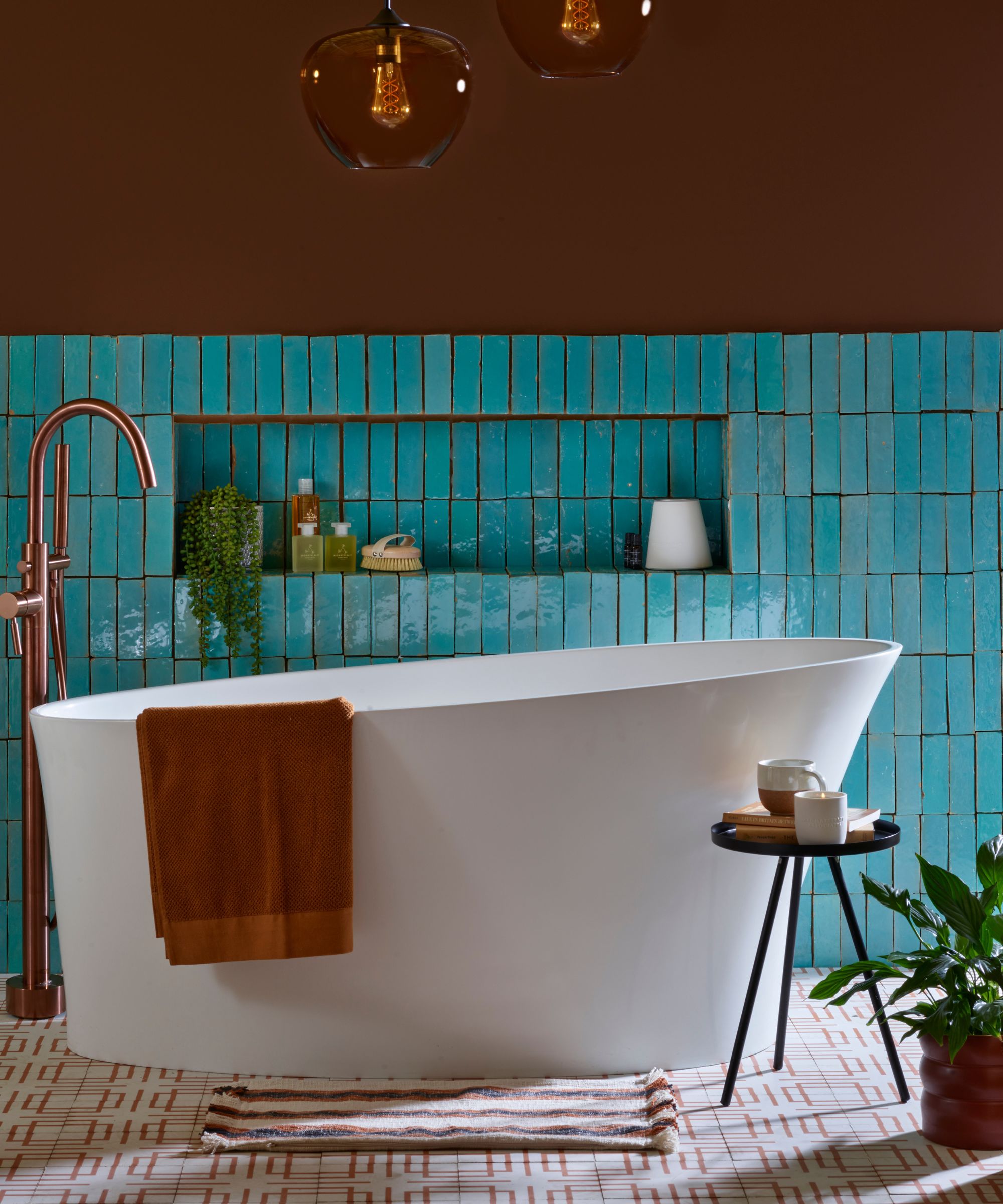 brown bathroom with turquoise tiles and a freestanding tub