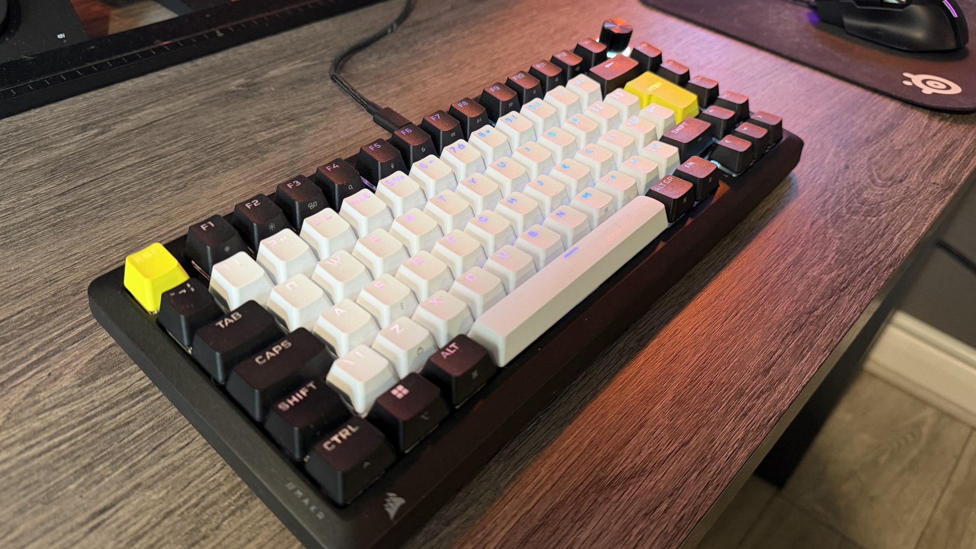 Corsair Makr Pro 75 gaming keyboard on a wooden desk
