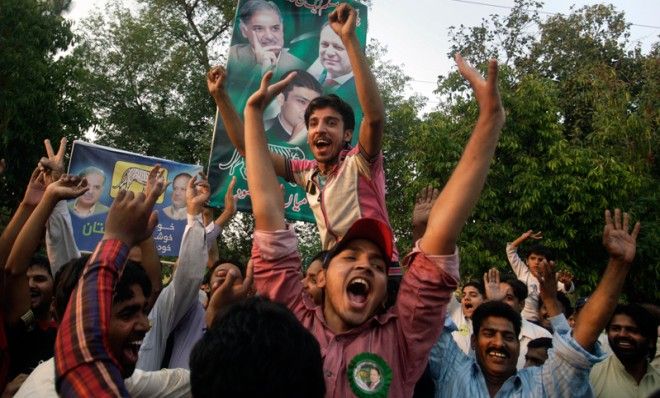 Supporters of former Pakistani Prime Minister Nawaz Sharif, celebrate their party&amp;#039;s victory in Lahore, Pakistan, May 12.