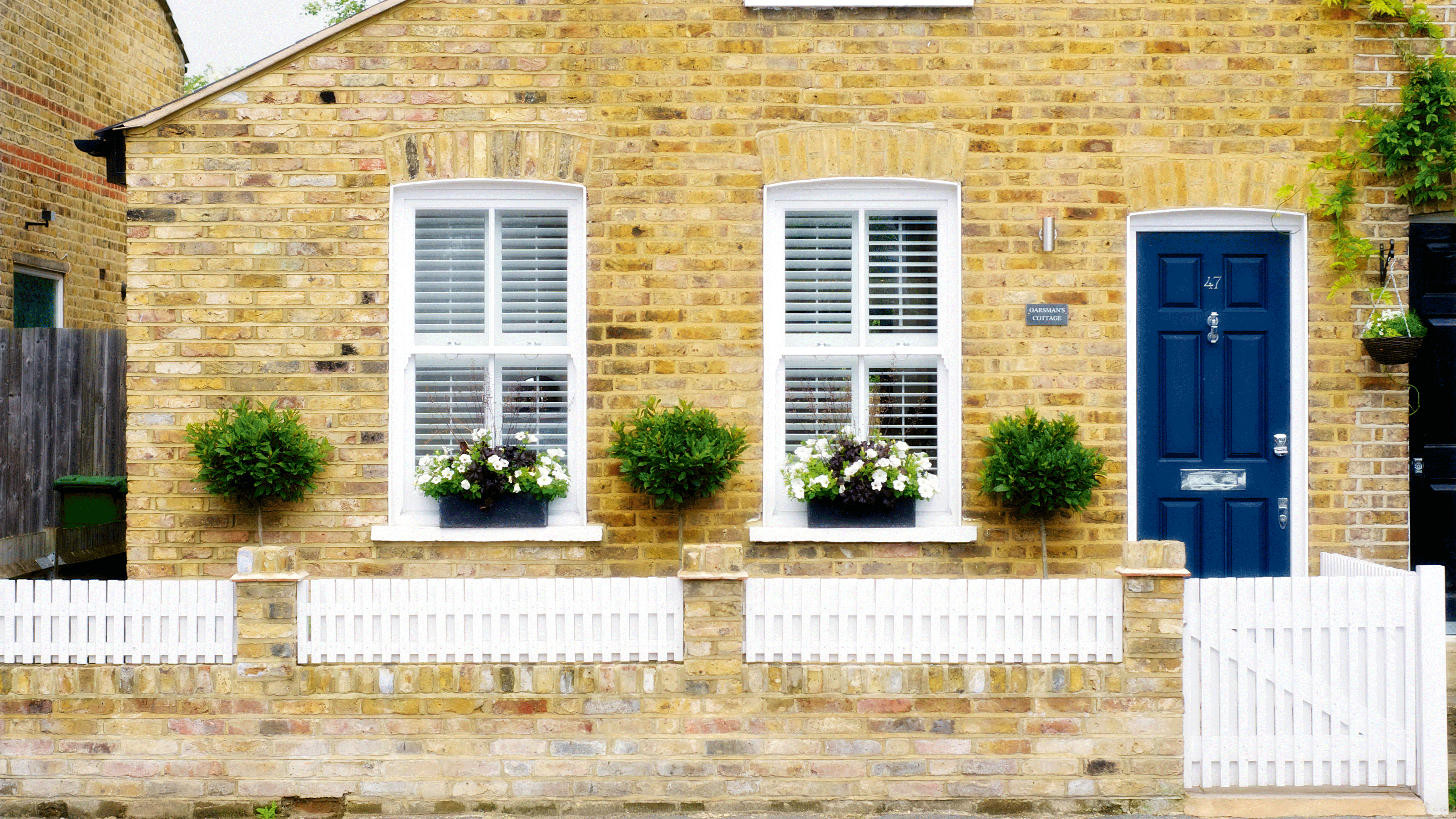 Yellow brick house with blue door