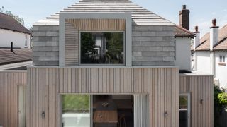 contemporary house with clay tile cladding and timber cladding