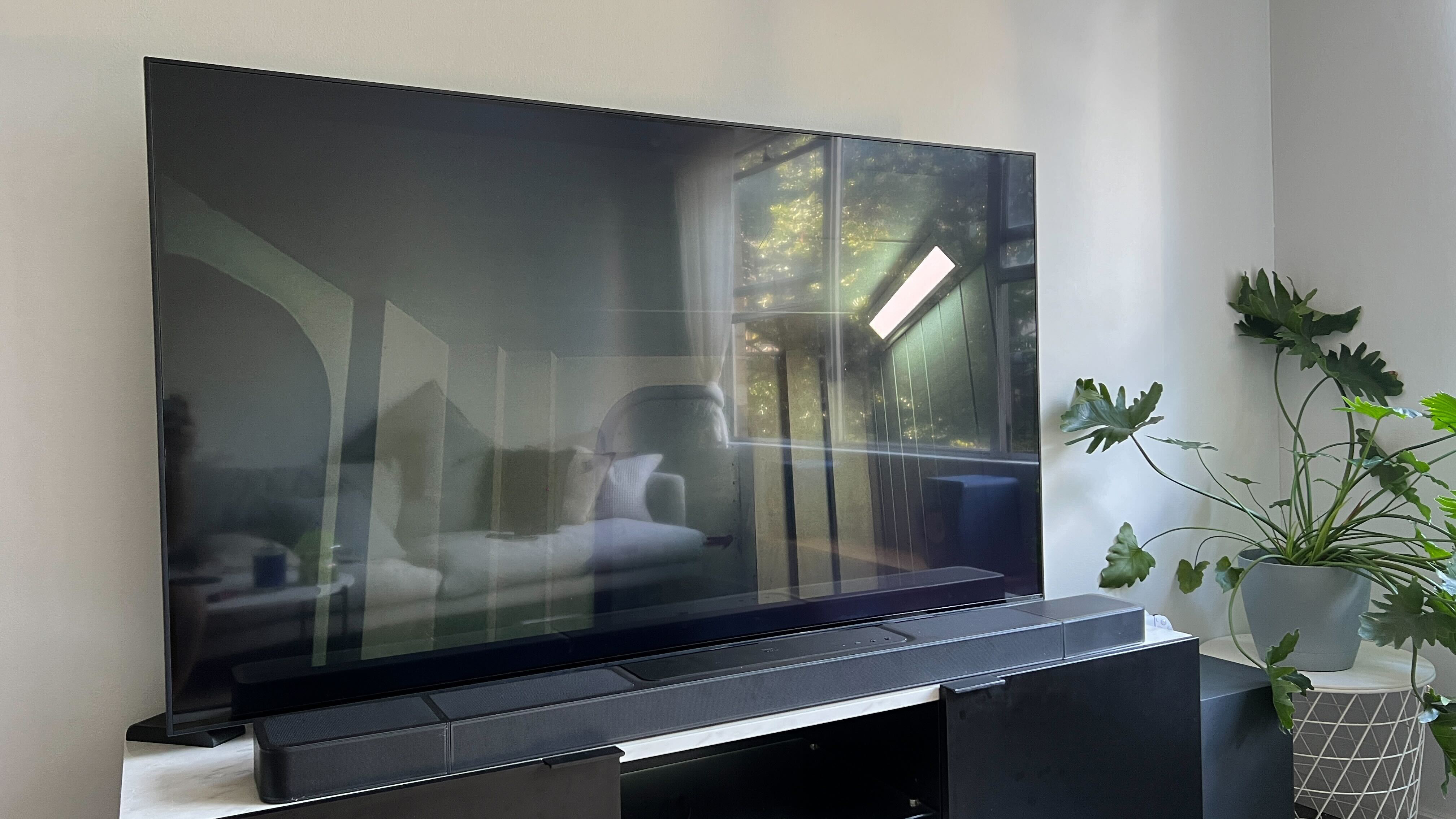 LG QNED81 TV with reflective surface