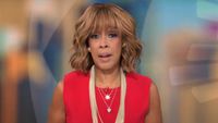 Gayle King sits on set during a report on CBS Mornings. 