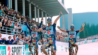 Team Mapei-GB Belgium Johan Museeuw (C) flanked by Italian Gianluca Bortolami (R) and Andrea Tafi celebrates after winning the 100th edition of the Paris-Roubaix cycling race in Roubaix on April 14, 1996. / AFP PHOTO / Patrick KOVARIK (Photo credit should read PATRICK KOVARIK/AFP via Getty Images)