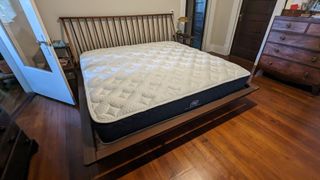 Brooklyn Bedding Signature Hybrid mattress with Cloud Pillow Top on a bed frame in reviewer's room