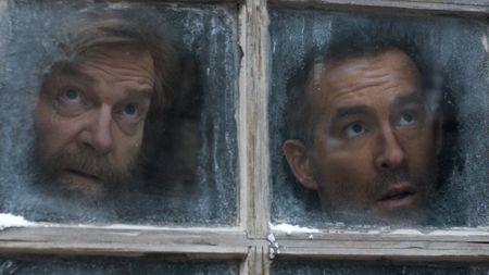 Troy and Nikolai look out the window of his place. 