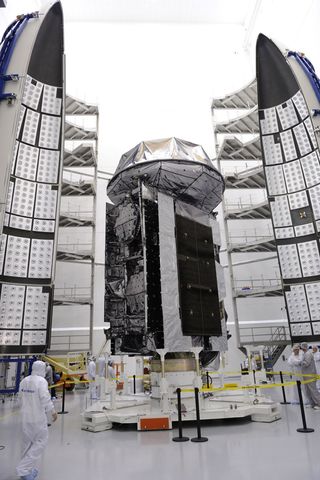 The U.S. Navy's first Mobile User Objective System (MUOS) satellite is encapsulated in a 5-meter diameter payload fairing in preparation for launch aboard a United Launch Alliance Atlas V launch vehicle