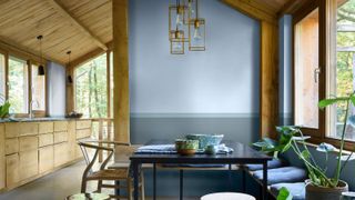 a timber kitchen with a dining room