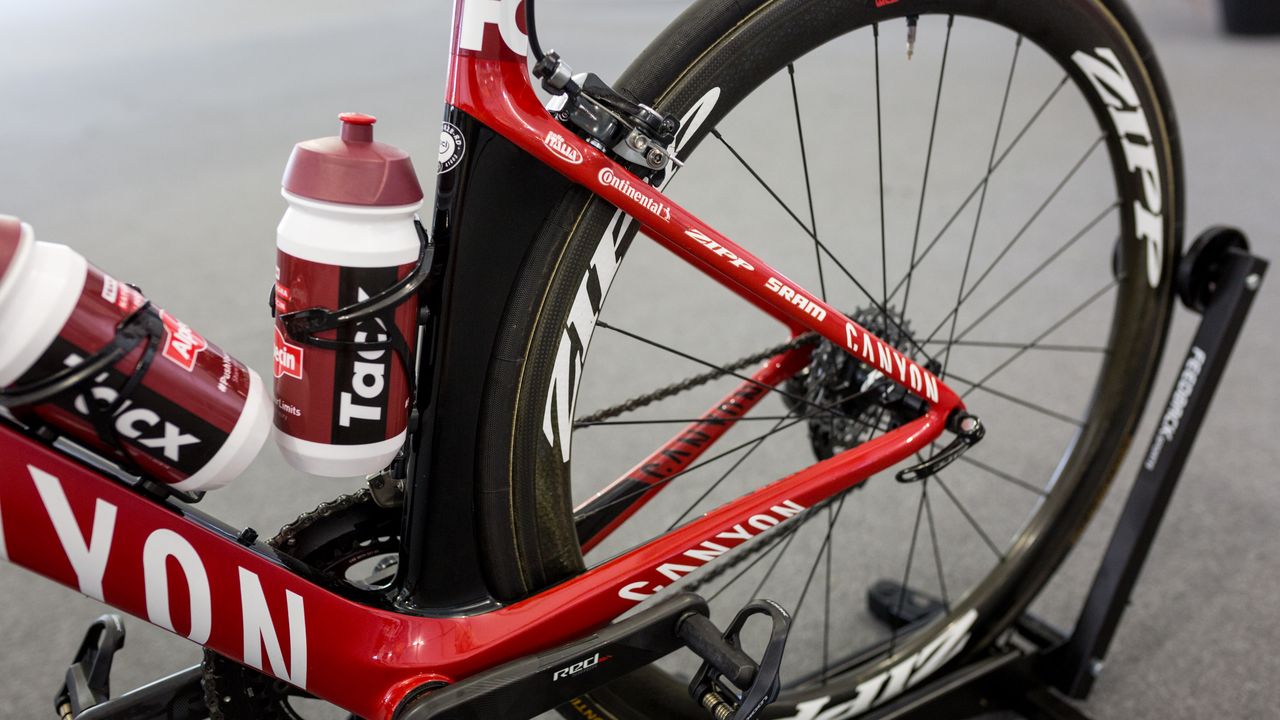 The seat tube is shaped around the rear wheel