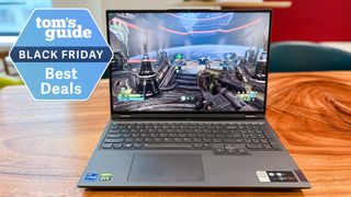 Lenovo Legion 5 on table with Tom's Guide Black Friday Best Deals badge