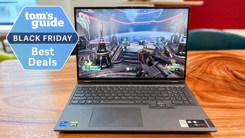 Lenovo Legion 5 on table with Tom&#039;s Guide Black Friday Best Deals badge