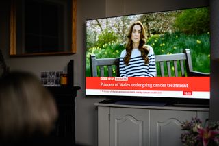 A relative of the Photographer watches television, as Catherine, The Princess of Wales announces that she is receiving a preventative course of chemotherapy for cancer on March 22, 2024 in London, England.