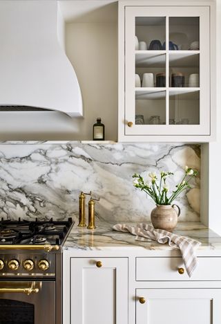 a kitchen with boldly veined marble countertop