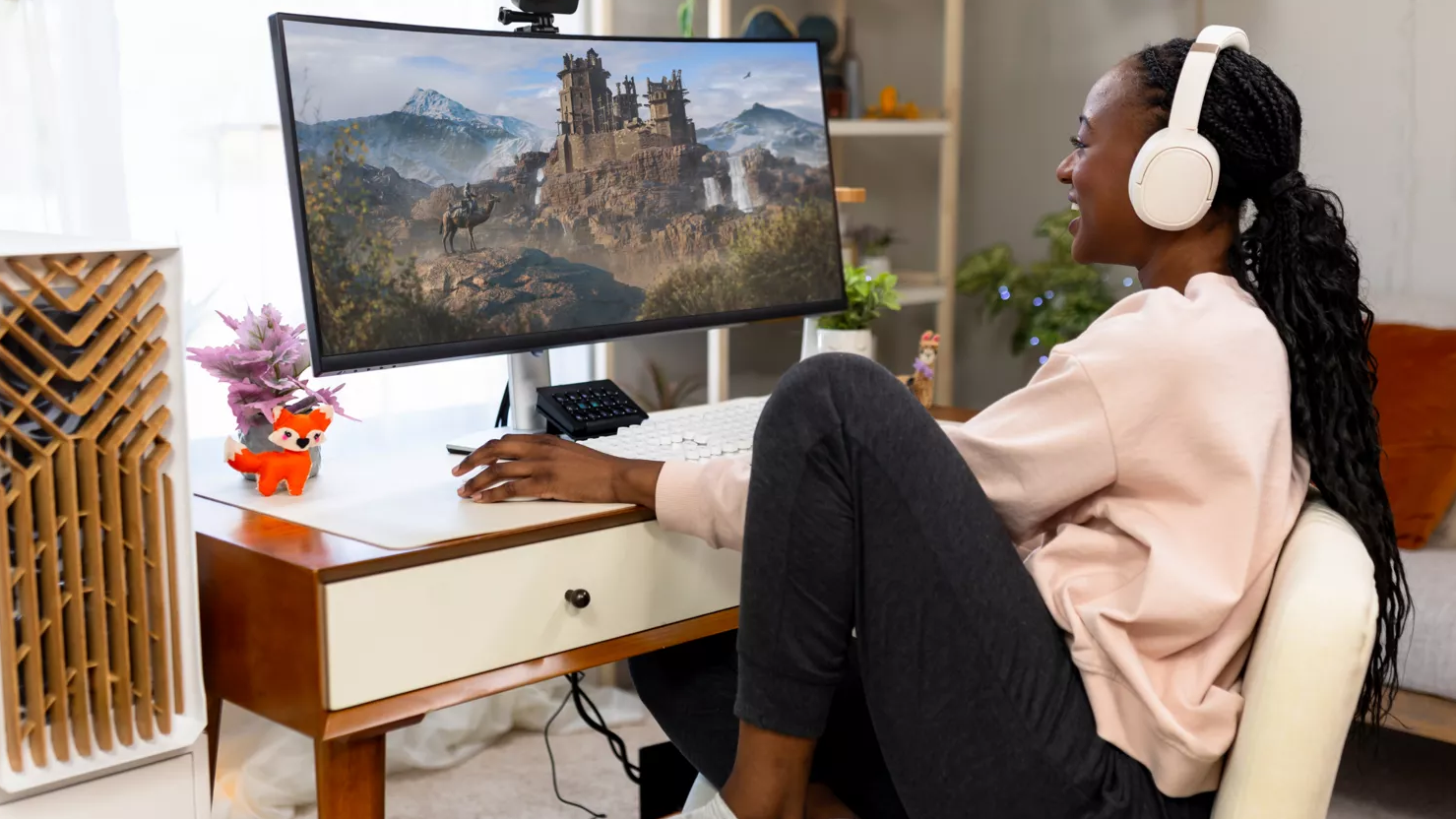 A woman playing on an Intel desktop