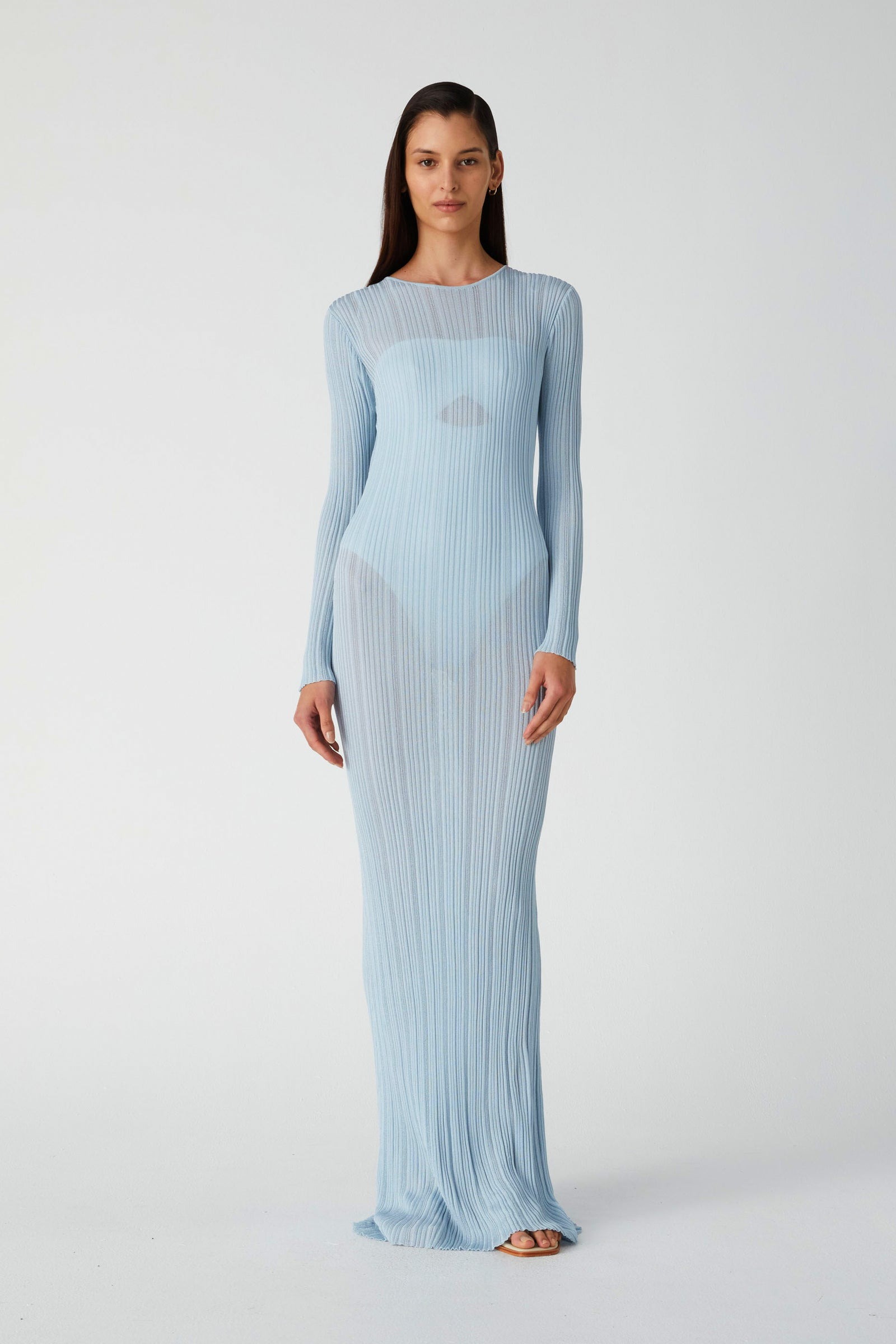 model wearing a maxi dress in light blue