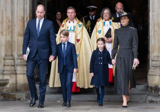 Prince William, Duke of Cambridge, Prince George of Cambridge, Princess Charlotte of Cambridge and Catherine, Duchess of Cambridge depart the memorial service for the Duke Of Edinburgh