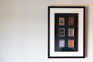 Nintendo playing cards in frame on wall at Marufukuro hotel, Kyoto