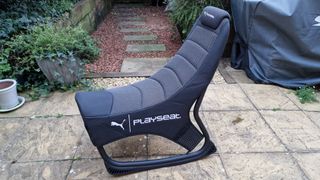 Profile picture of the PlaySeat Puma Active gaming seat in a garden