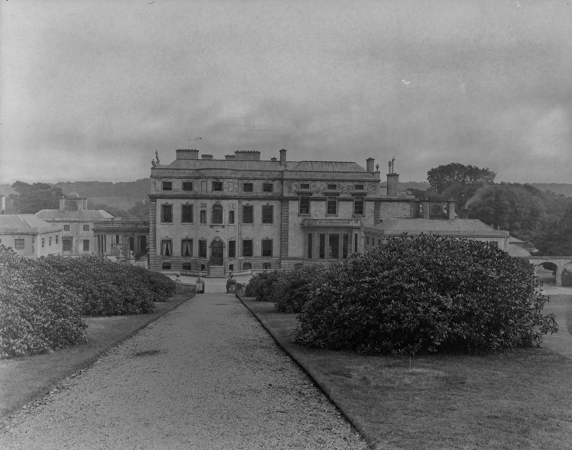 Black-and-white photographs of a neo-Palladian manor house