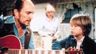 Robert Duvall at a table in Tender Mercies