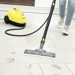 yellow steam cleaner on white floor