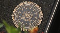 FBI seal and insignia pictured on the FBI headquarters building in Washington D.C., United States.