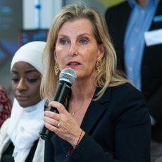 Duchess Sophie speaking into a microphone wearing a black blazer