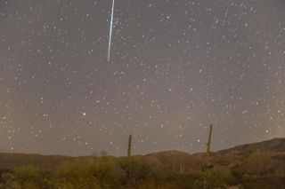 A giant Geminid meteor bursts into the edge of the frame in this shot taken by astrophotographer BG Boyd in Tucson, Arizona.